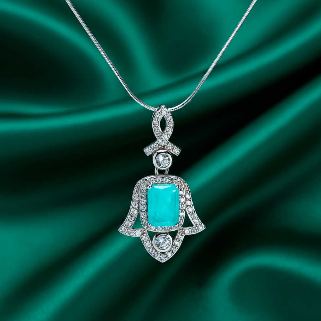 Close-up Amulet of Light pendant displaying tourmaline brilliance and rhodium craftsmanship