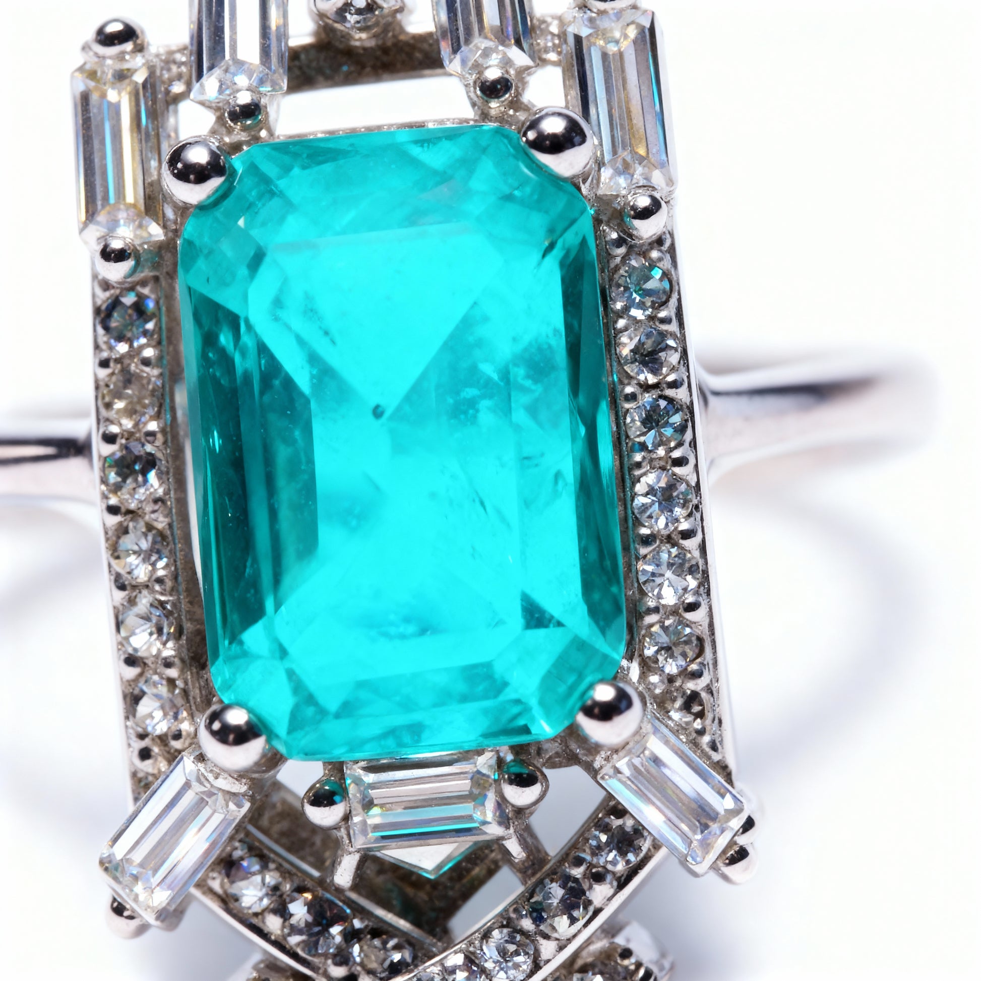 Close-up detail Emerald Portal ring showing mystical stone clarity and rhodium finish craftsmanship