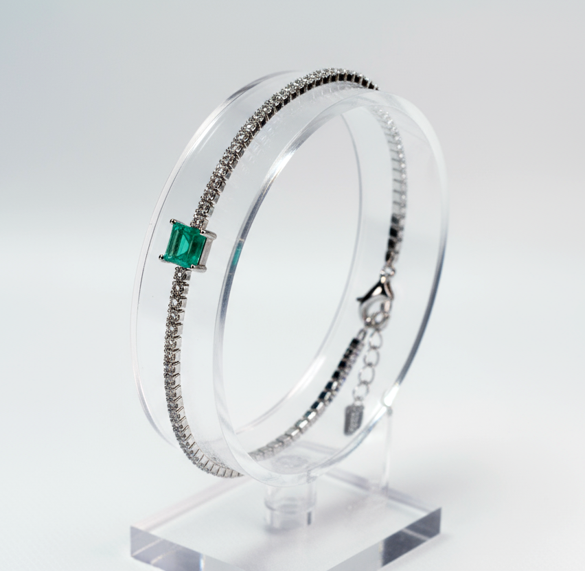 Artistic view Green Essence bracelet emphasizing positive energy amulet and subtle sparkle