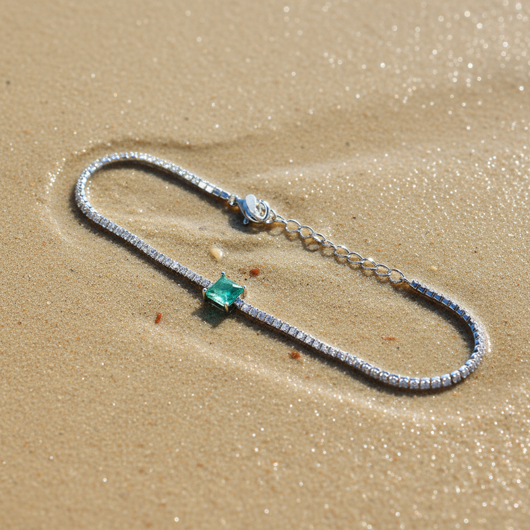 Green Essence bracelet on beach setting displaying natural beauty and ocean-inspired elegance