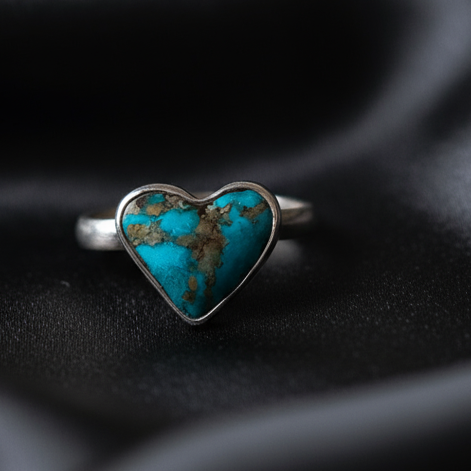 Side view Turquoise Heart ring highlighting handcrafted silver setting and heart shape