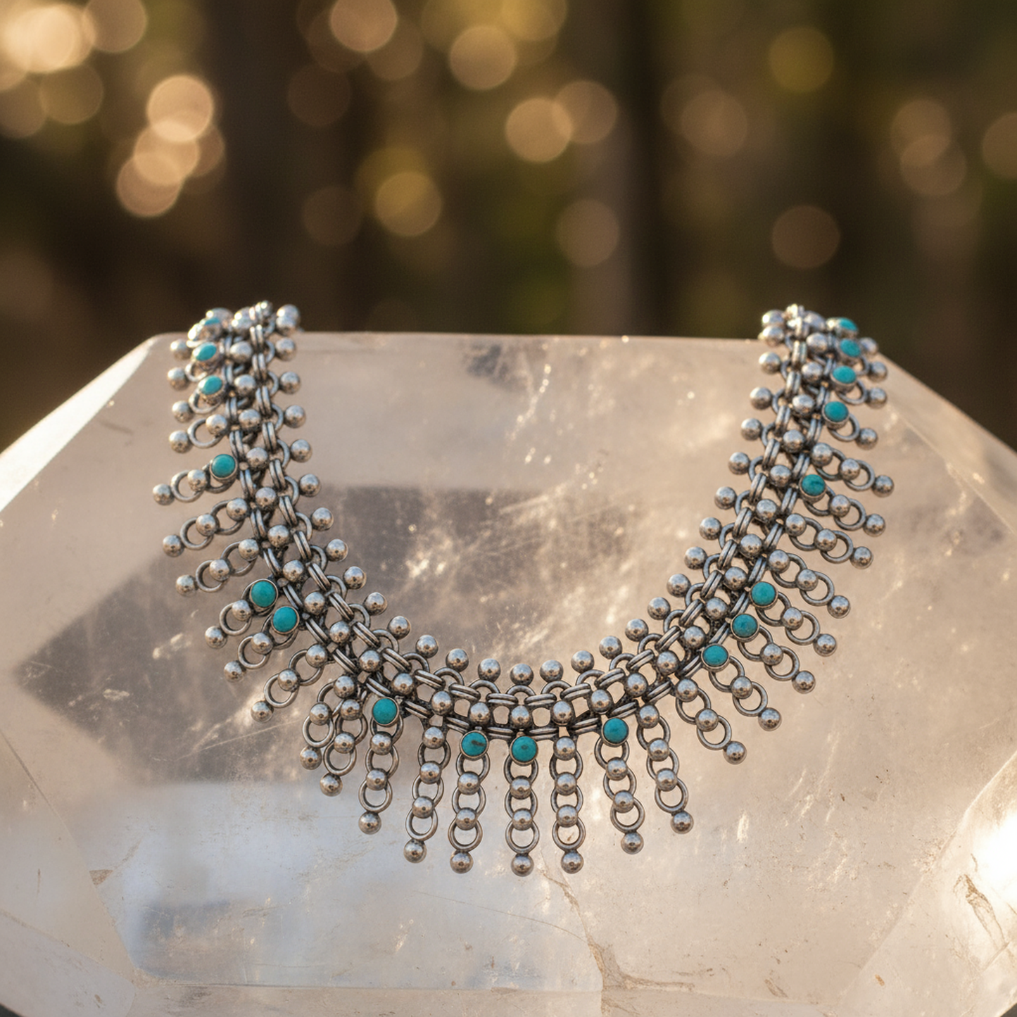 Close-up Vintage Silver Set earrings displaying turquoise center rosettes and dancing droplets