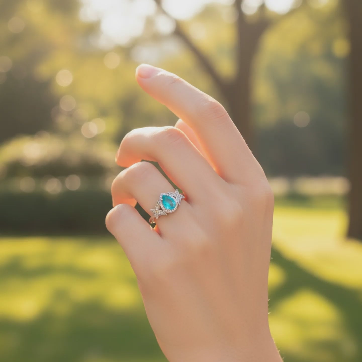 Lotus Tear ring with green tourmaline and lotus motifs - product showcase video