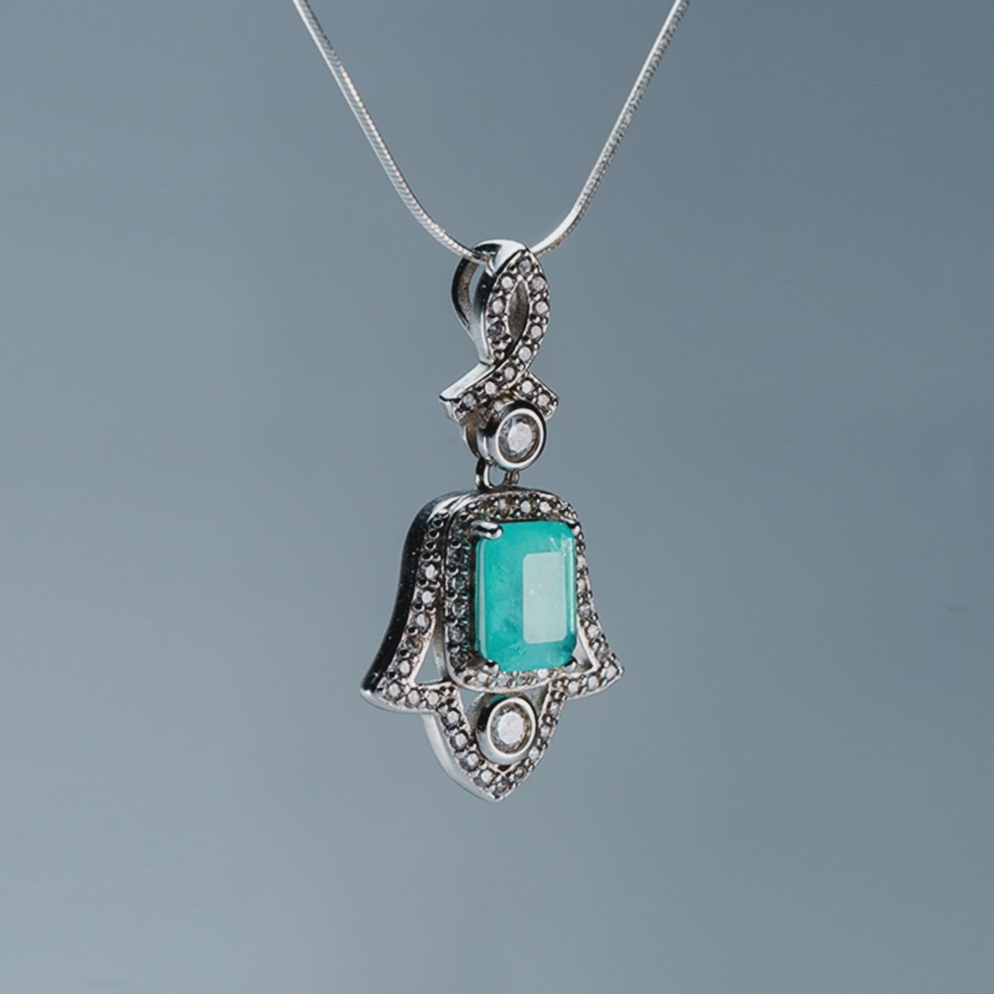 Amulet of Light Hand of Fatima pendant with green tourmaline - product showcase video