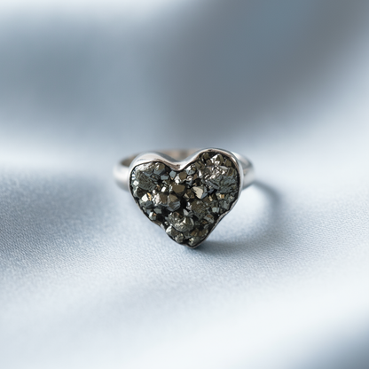 Golden Heart ring at angle showing abundance symbolism and protective energy