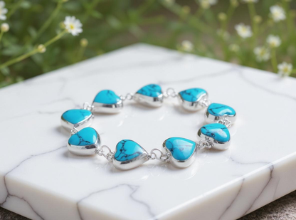 Side view Heart of Heaven bracelet highlighting handcrafted silver setting and heart design