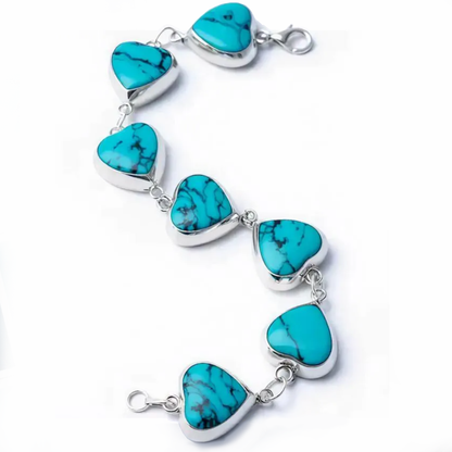 Detail macro Heart of Heaven bracelet highlighting turquoise heart precision and silver craftsmanship