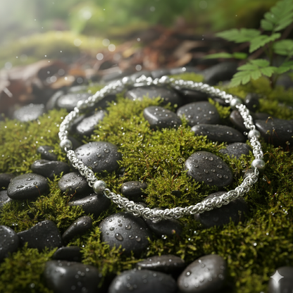 Close-up Moon Path necklace displaying minimalist design and light-reflecting spheres