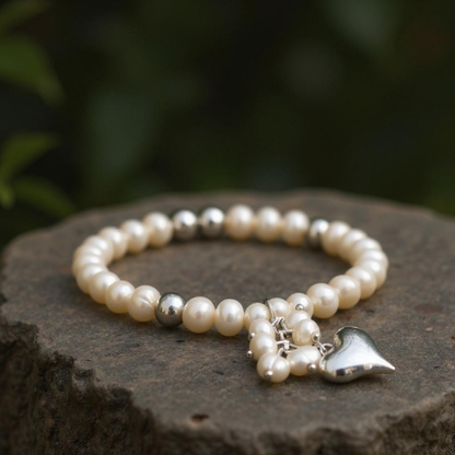 Side view Mother-of-Pearl Heart bracelet highlighting ocean-born pearls and elastic band