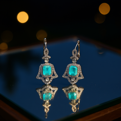 Close-up Wings of Protection earrings displaying rectangular-cut tourmaline and rhodium finish