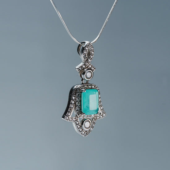 Amulet of Light Hand of Fatima pendant with green tourmaline - product showcase video